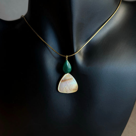gold snake chain herringbone necklace with a malachite mother of pearl pendant Necklace with two pendant stones on a black background