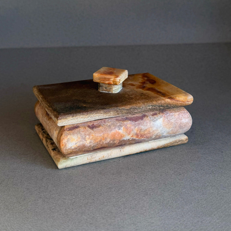 Hand carved raw onyx keepsake box with square lid in rust, honey, and cream tones