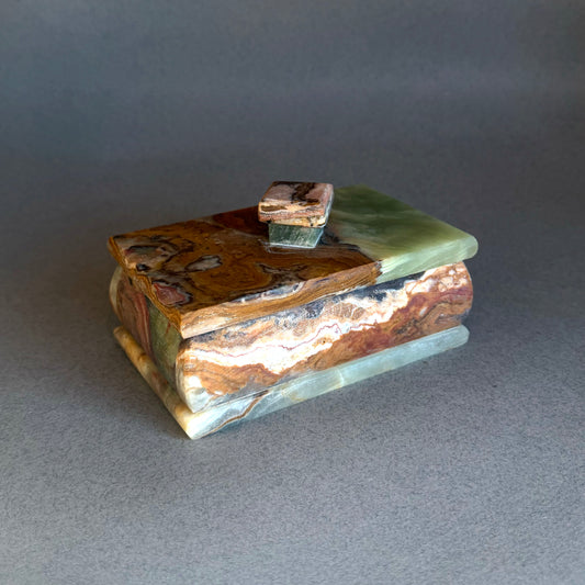 Decorative box with a marbled pattern on a gray background