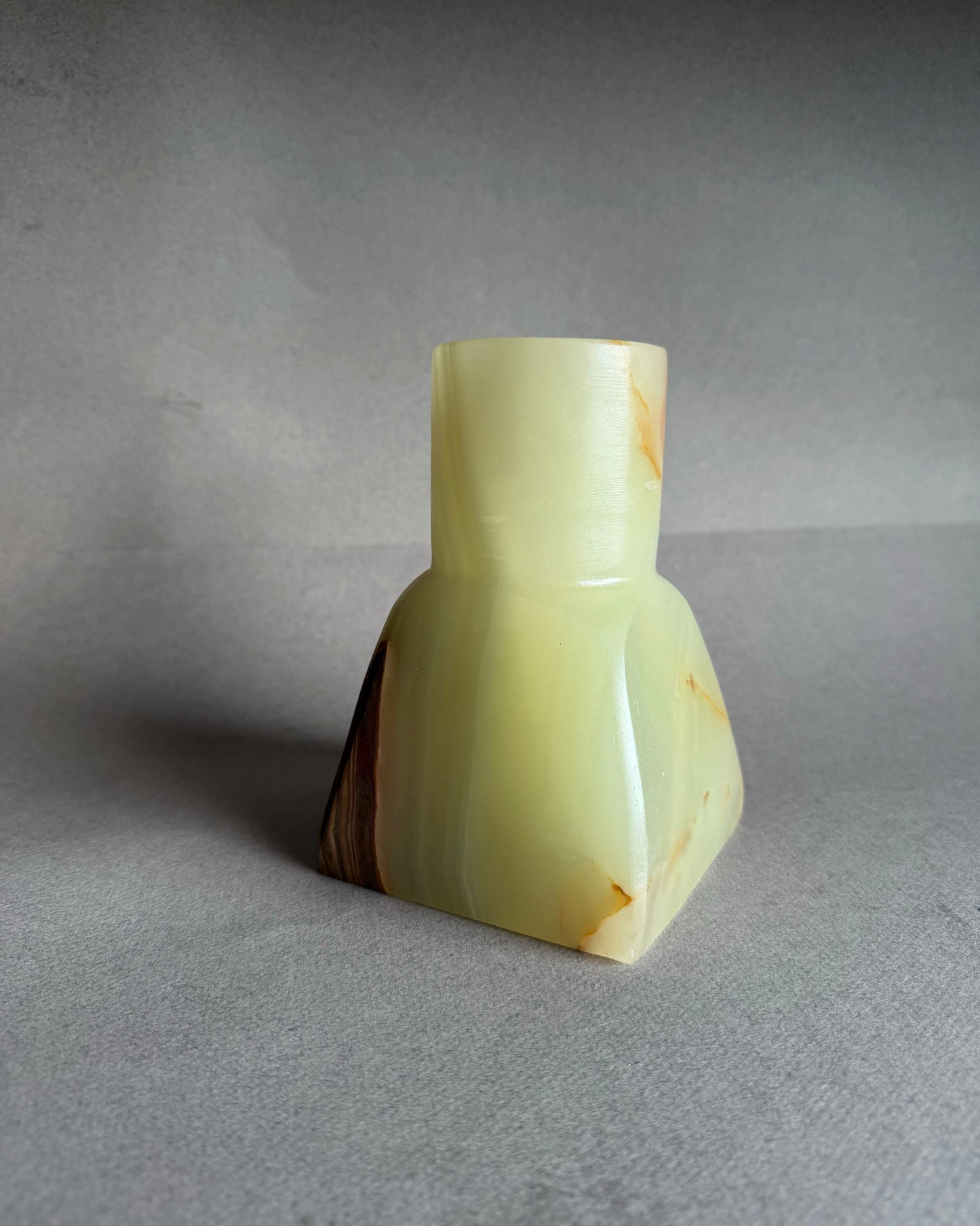 Raw onyx vase with soft green translucency and layered amber and rust tones, one of a kind stone decor
