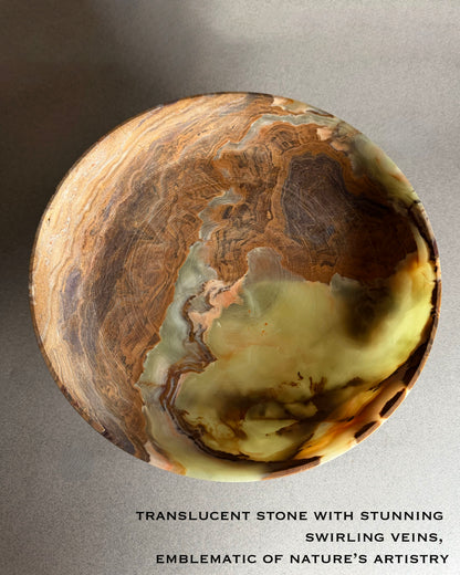 Translucent onyx stone bowl with swirling veins on a gray background