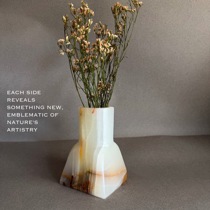 Vase with dried flowers on a gray background white onyx vase 