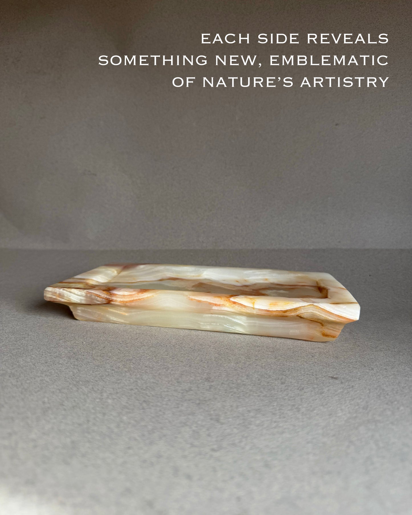 Decorative stone tray on a gray background with text about nature's artistry