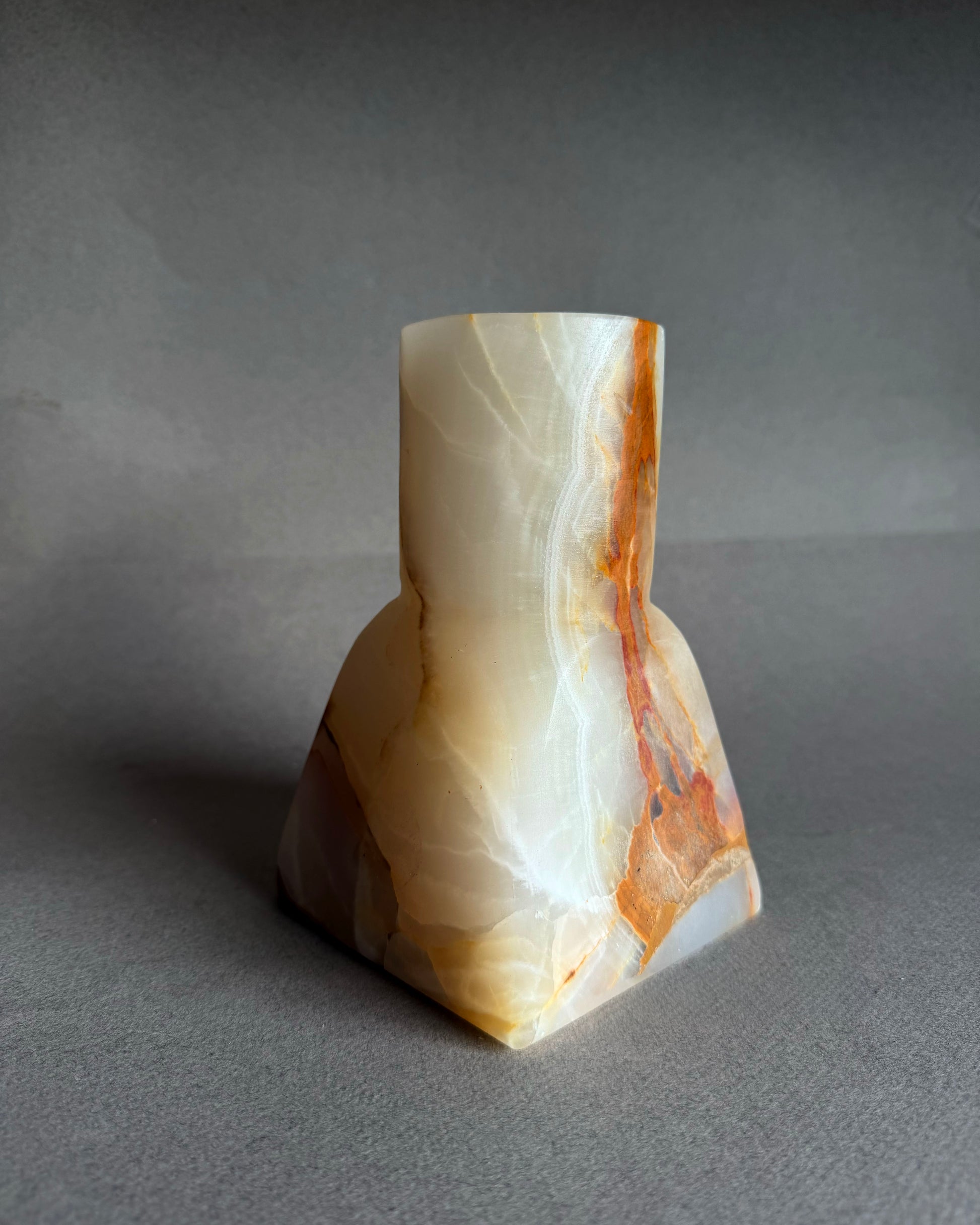 Decorative stone sculpture on a gray background