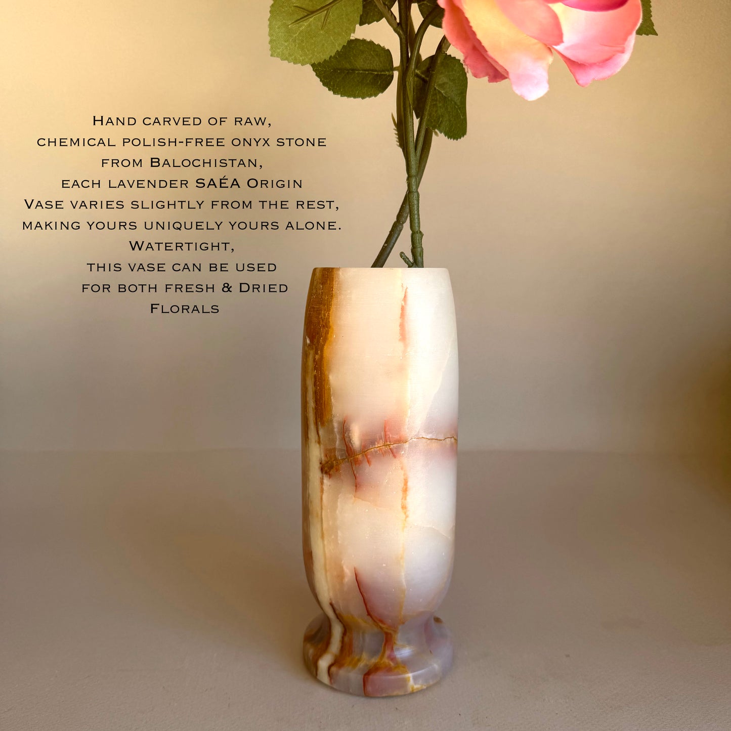 Onyx vase with floral arrangement on a beige background