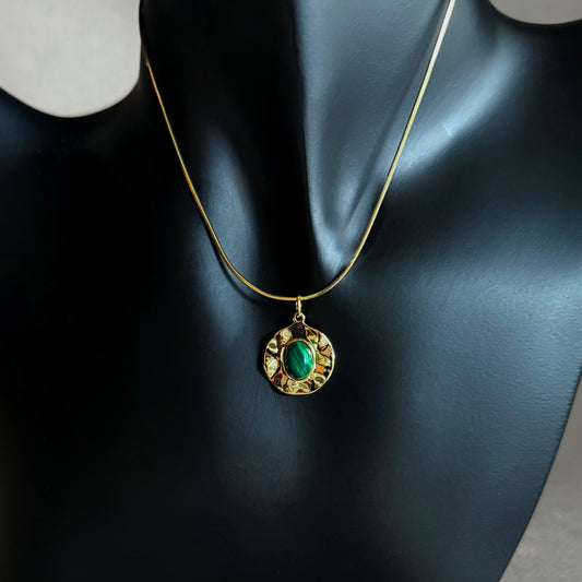 14k Gold Filled necklace with a green malachite pendant on a mannequin bust.