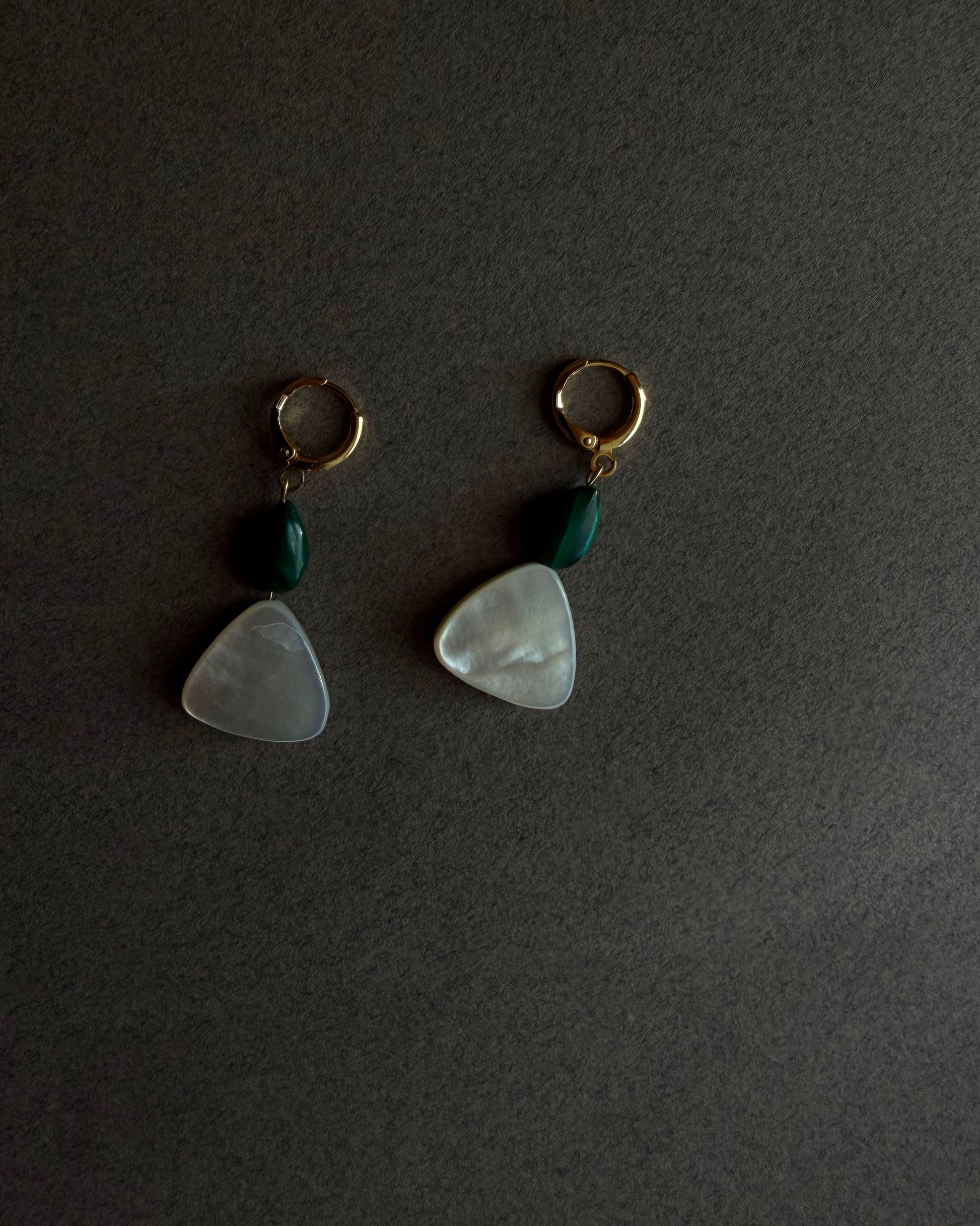 Pair of earrings with green beads and white stone drops on a dark background. MALACHITE MOTHER OF PEARL GOLD HOOP HUGGIE 