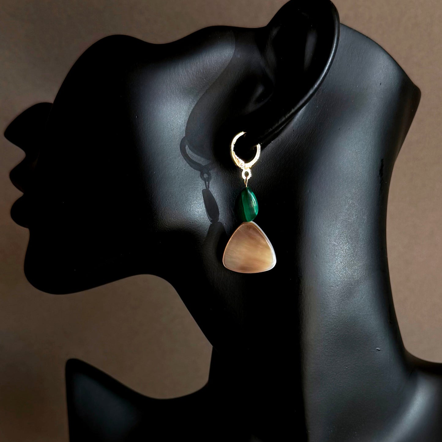 MALACHITE MOTHER OF PEARL GOLD HOOP HUGGIE Earring on a black mannequin head against a beige background