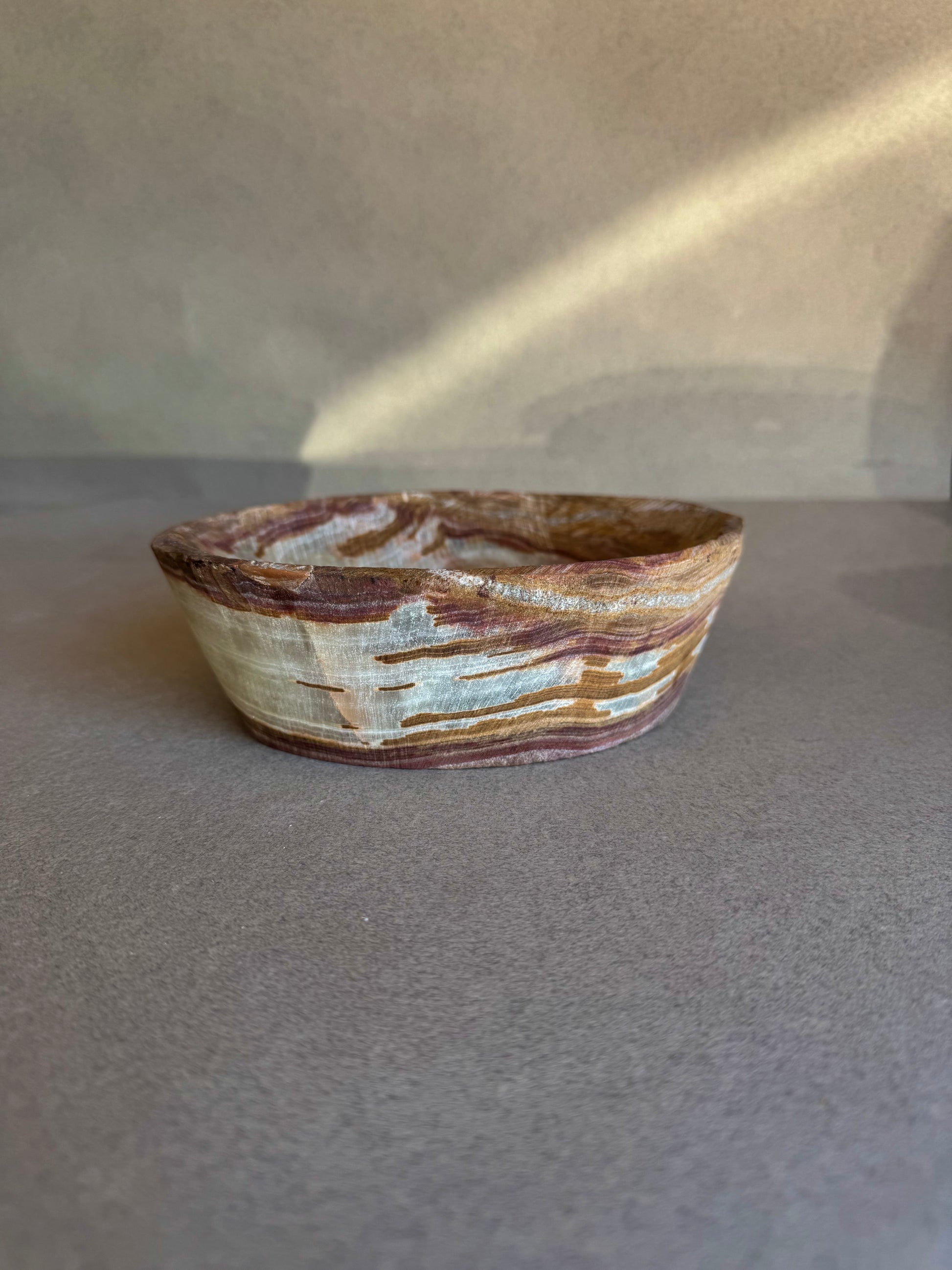 Sustainable onyx catchall bowl with natural marbling, handmade in Balochistan