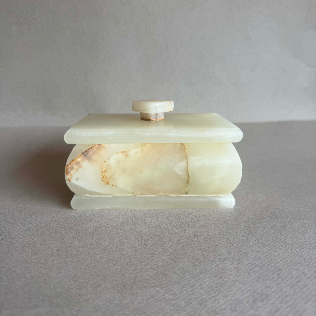 Rectangular onyx keepsake box with lid in nude green, ivory, and clay tones

