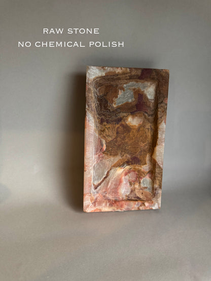 Raw stone block with natural texture on a gray background, labeled 'Raw Stone No Chemical Polish'.