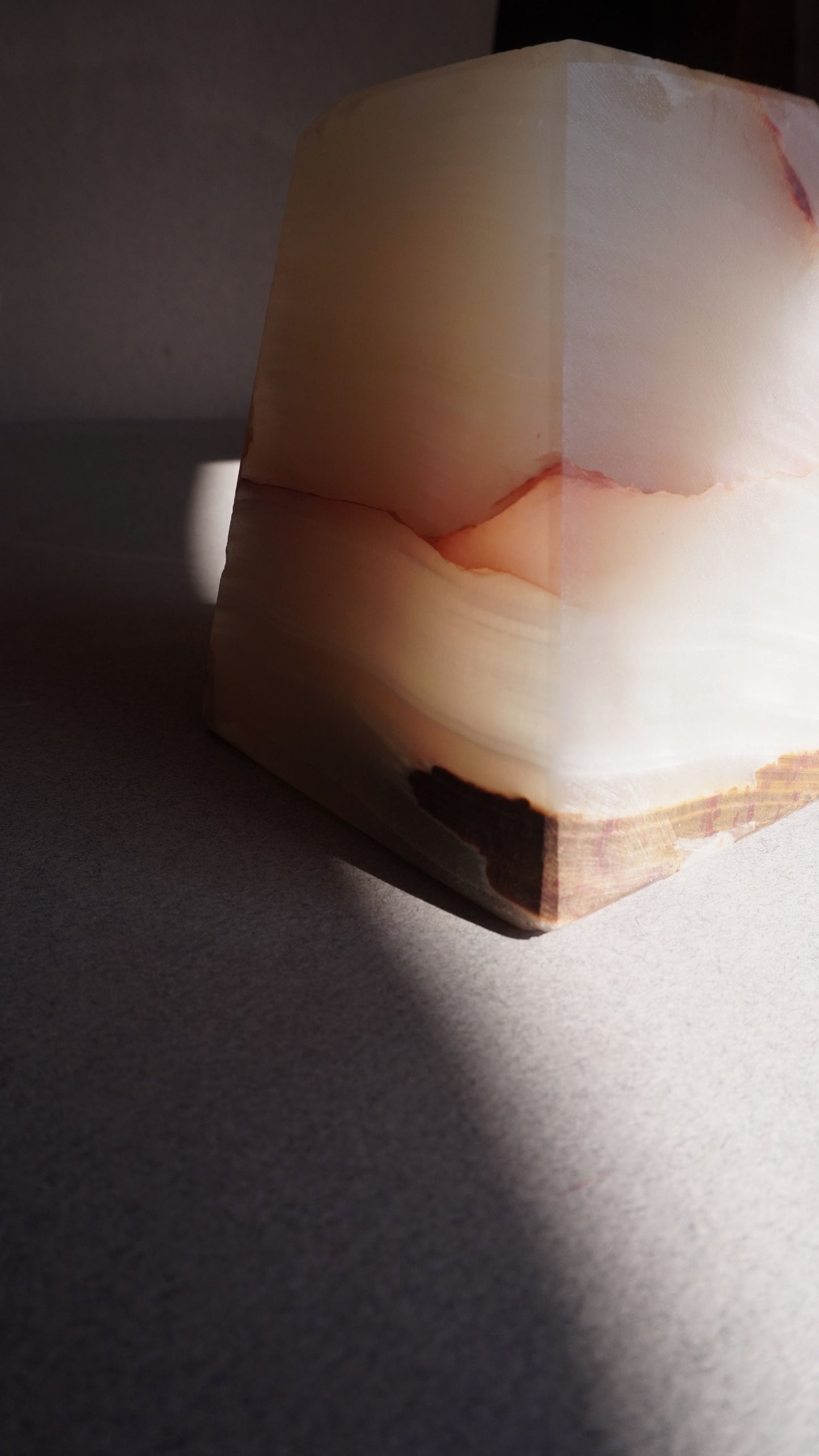 Geometric onyx sculpture on a dark surface