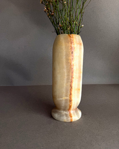 Decorative vase with a natural stone pattern on a gray background