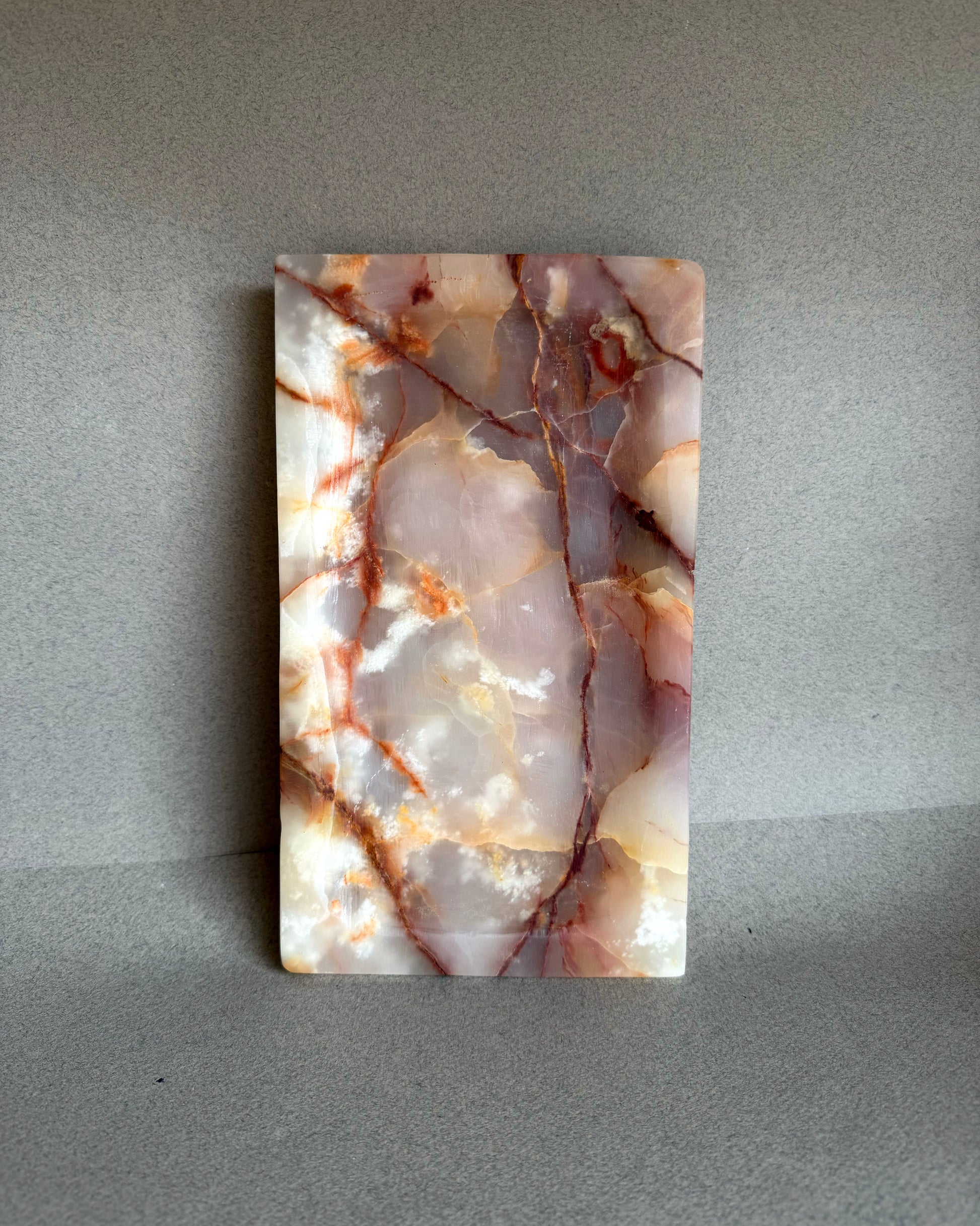 Onyx catchall tray styled on a neutral surface for jewelry or essentials
