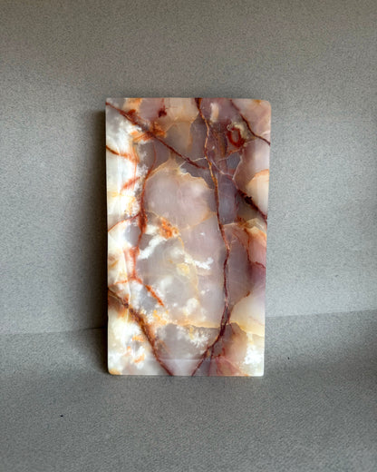 Onyx catchall tray styled on a neutral surface for jewelry or essentials
