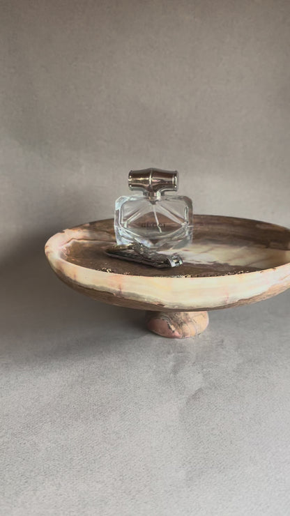 Unique hand-carved onyx pedestal bowl with earthy tones, sustainable luxury home decor piece for table styling, fruit, or jewelry storage.