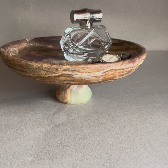Organic modern pedestal bowl carved from onyx stone, versatile as a fruit bowl, jewelry catchall, or sculptural centerpiece.