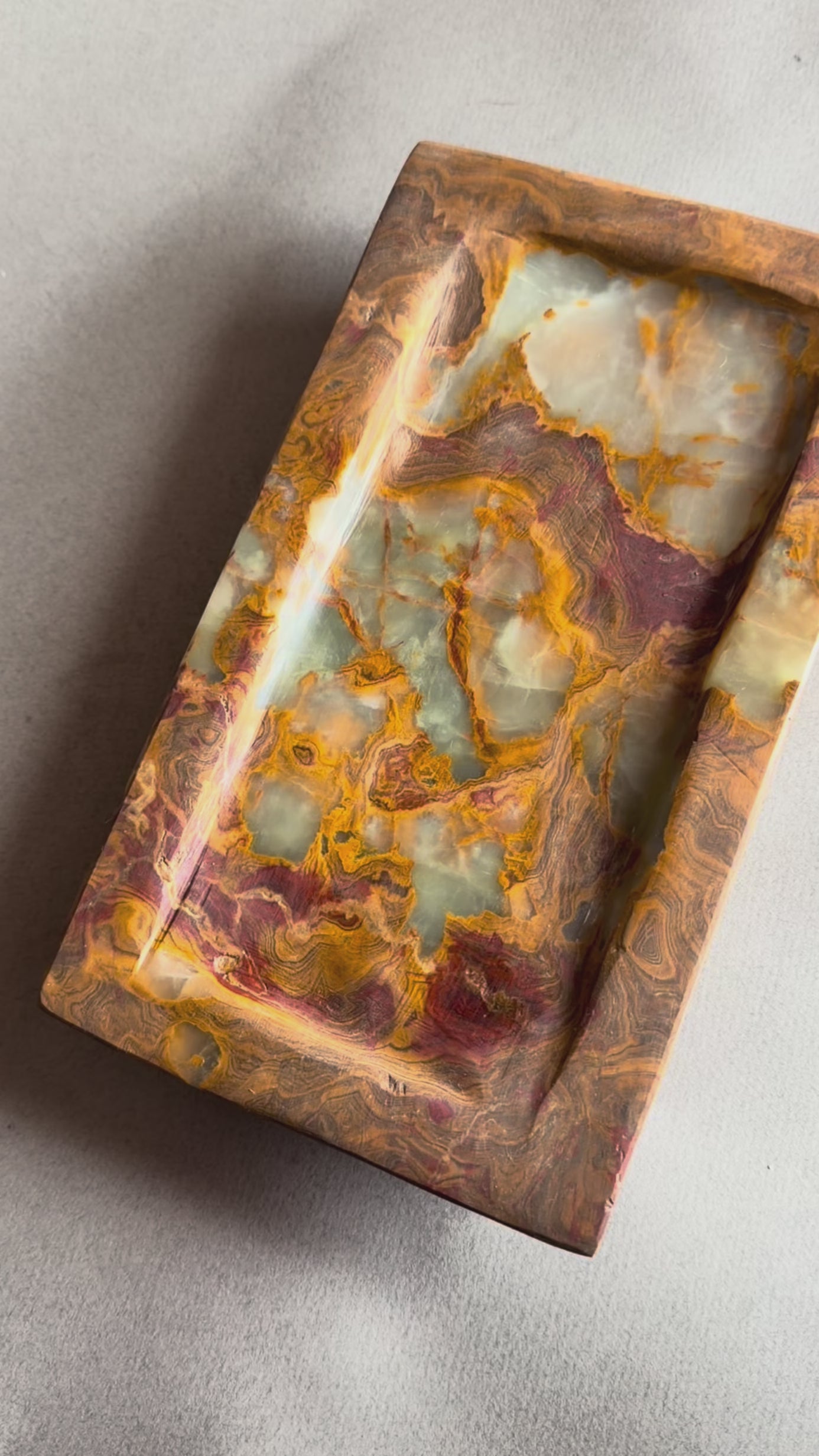 hand carved onyx catchall tray in brown, green and gold tones 