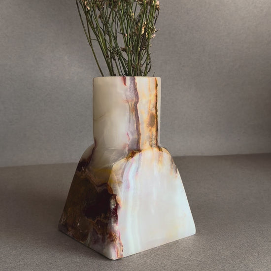 Hand-carved lavender onyx vase with soft cream and rust veining
