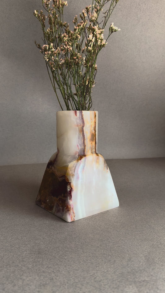 Hand-carved lavender onyx vase with soft cream and rust veining
