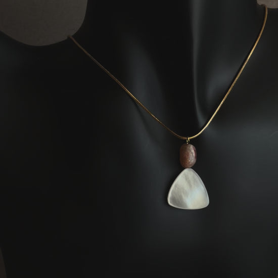 Minimal mother of pearl necklace with sunstone bead on gold snake chain
