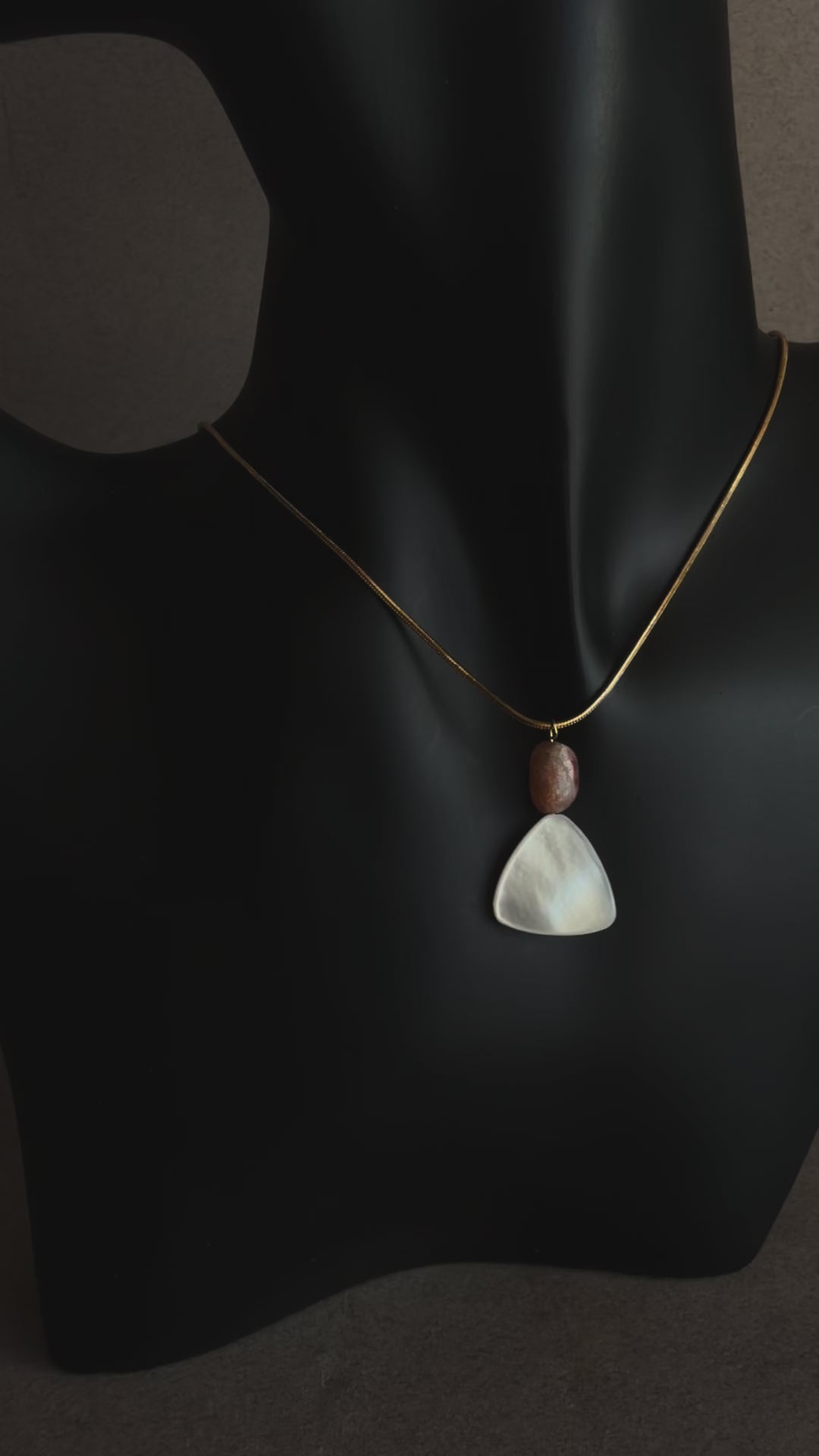 Minimal mother of pearl necklace with sunstone bead on gold snake chain
