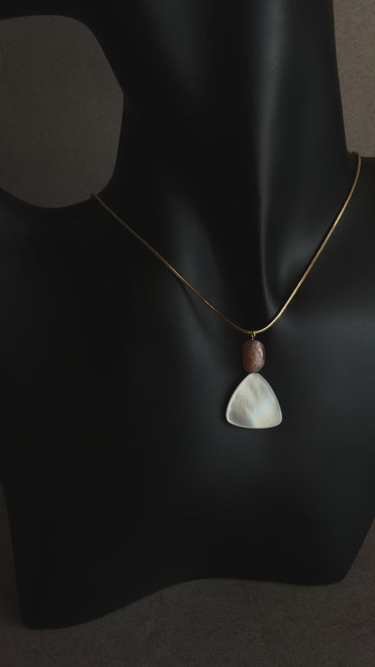Minimal mother of pearl necklace with sunstone bead on gold snake chain
