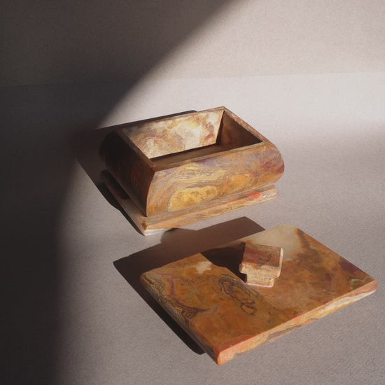 Natural stone onyx box with lid removed showing storage interior for jewelry or keepsakes  
