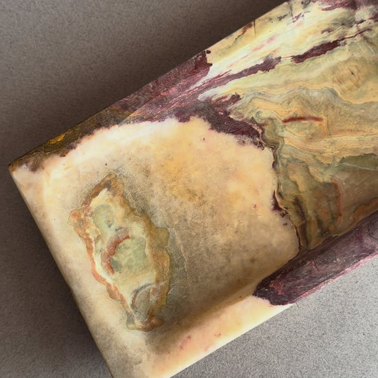 Rectangular natural onyx tray featuring deep plum, brown, and cream stone layers with stepped edge design
