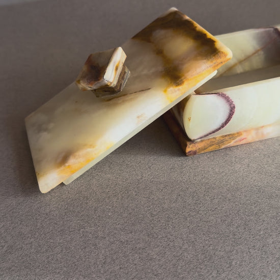 Rectangular onyx keepsake box with lid, featuring cream stone and warm rust veining
