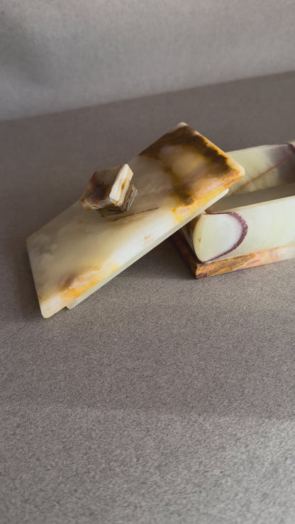 Rectangular onyx keepsake box with lid, featuring cream stone and warm rust veining
