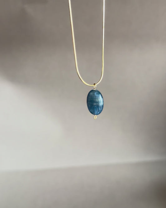 blue kyanite gemstone pendant on a gold snake chain necklace iridescent stone minimalist necklace jewelry