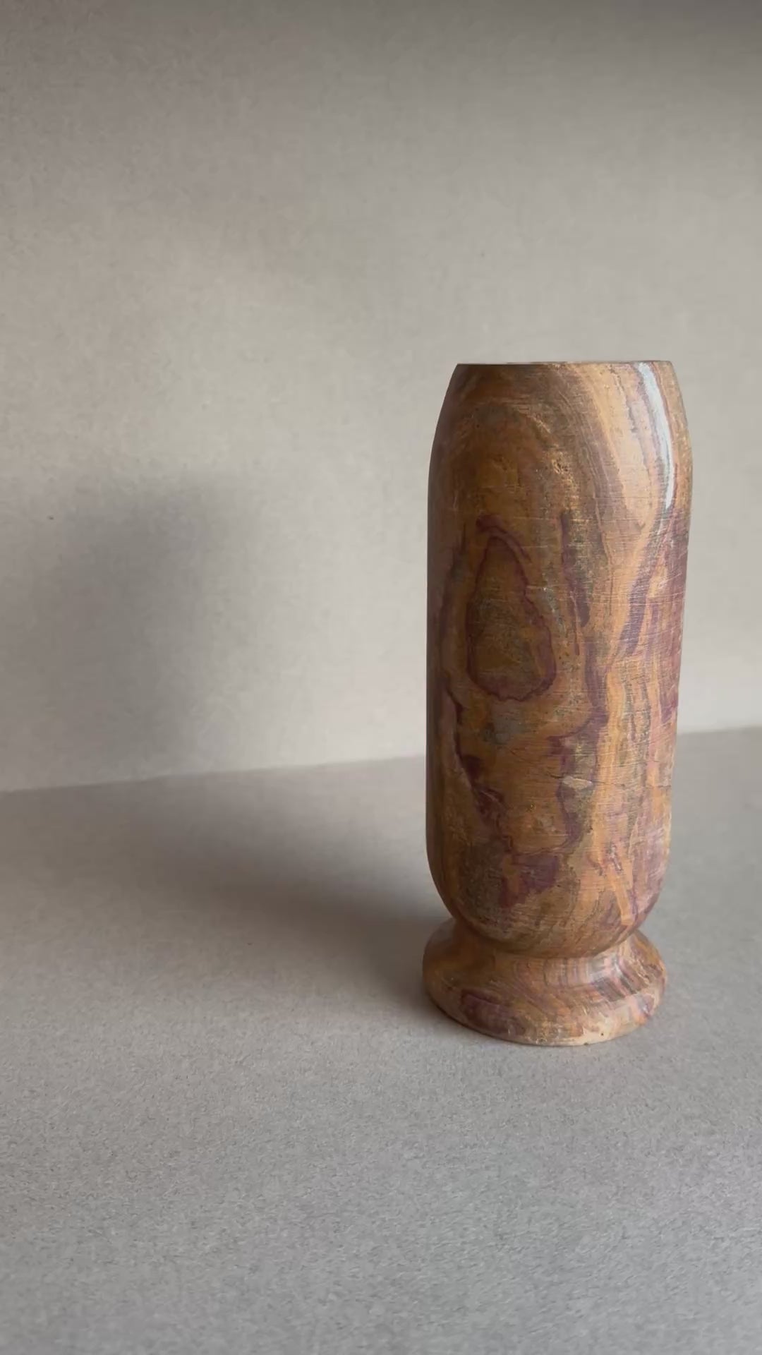 Ochre and plum onyx vase with natural stone banding

