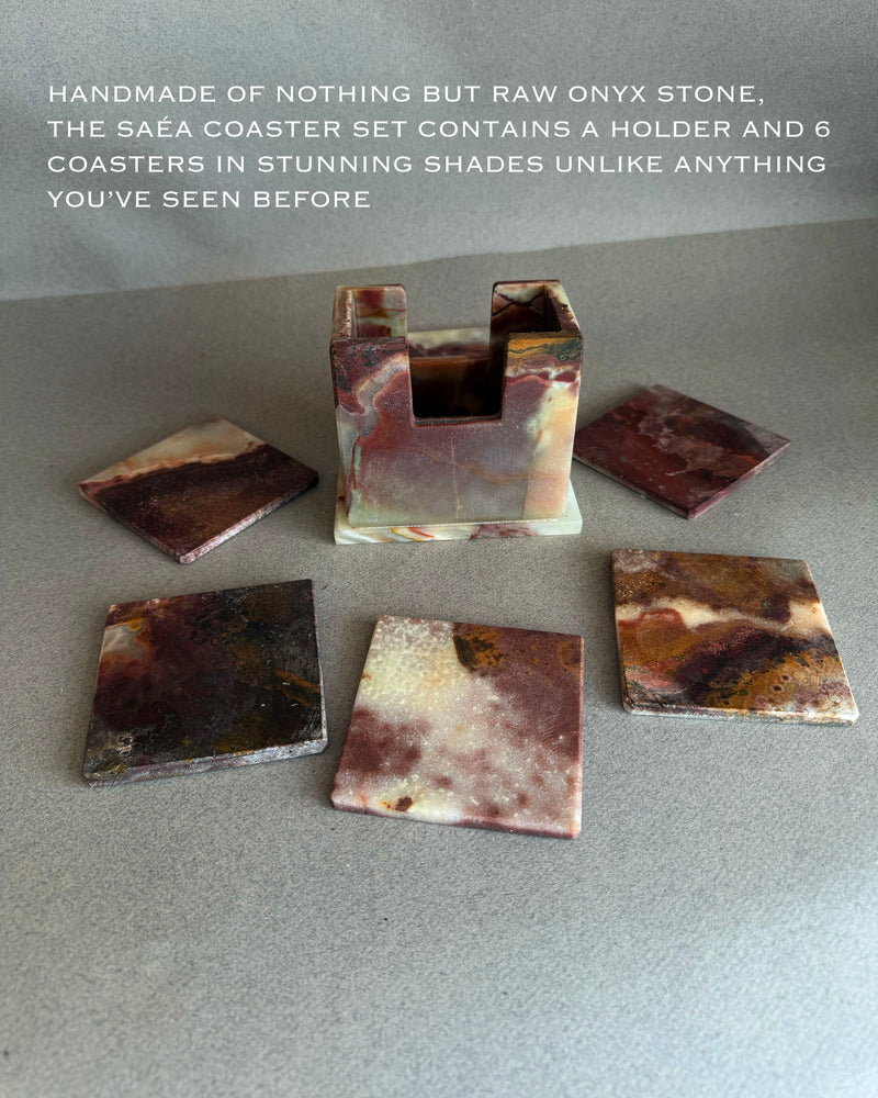 Hand carved stone coaster made from natural onyx featuring soft ivory tones with organic veining
