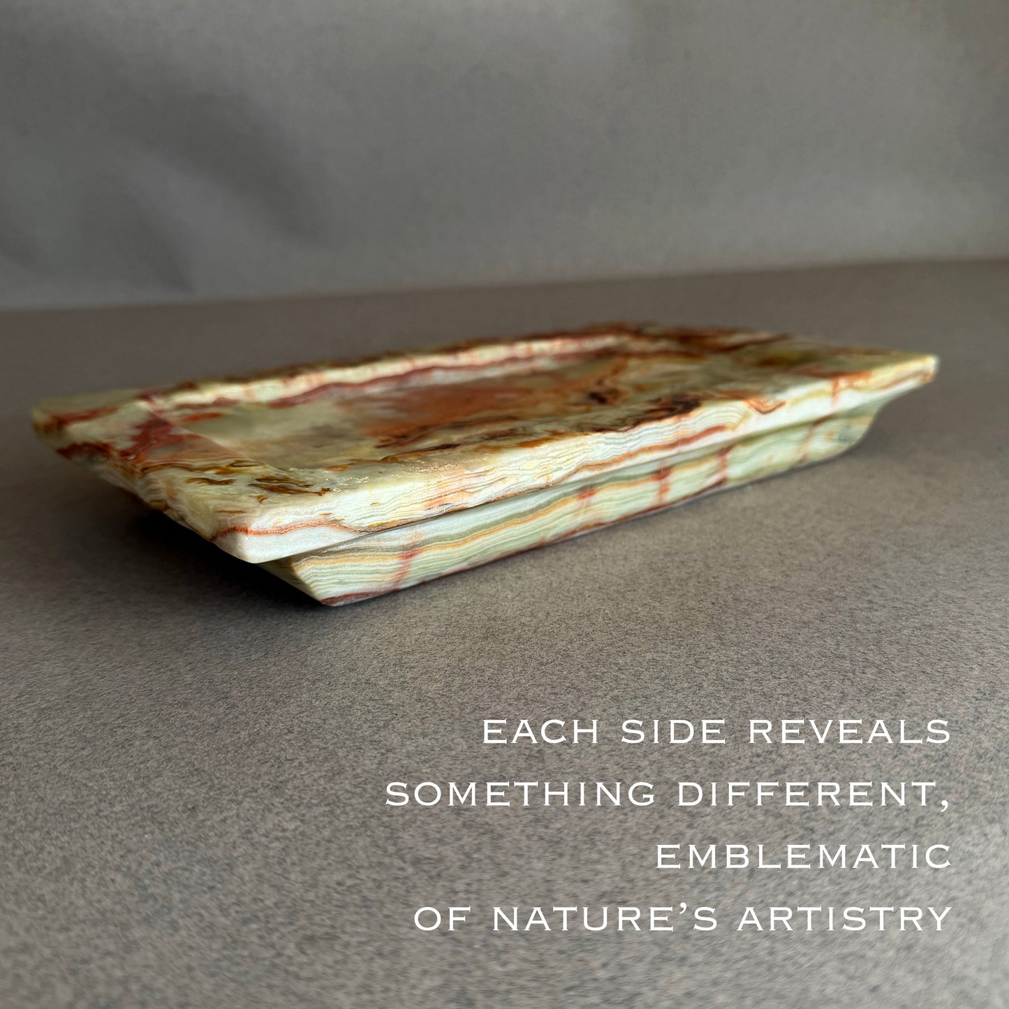 Decorative stone tray with natural patterns on a gray background