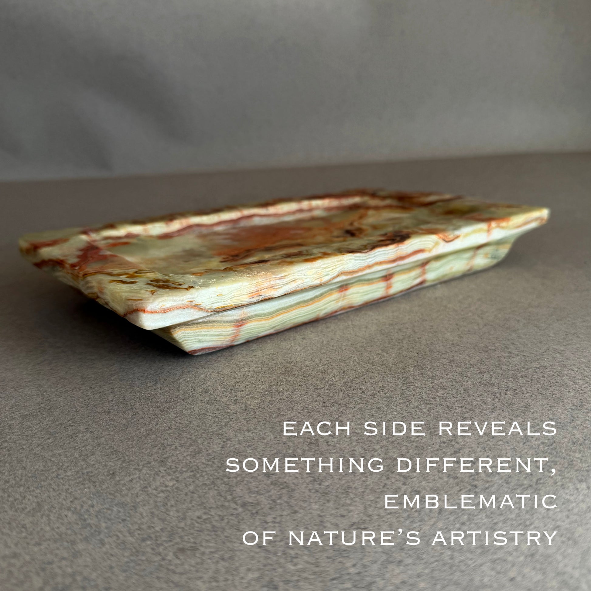 Decorative stone tray with natural patterns on a gray background