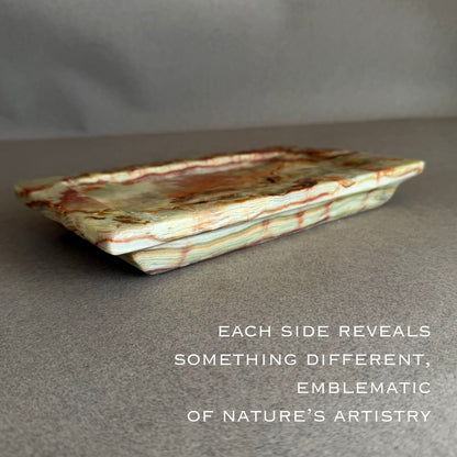 Decorative stone tray with natural patterns on a gray background