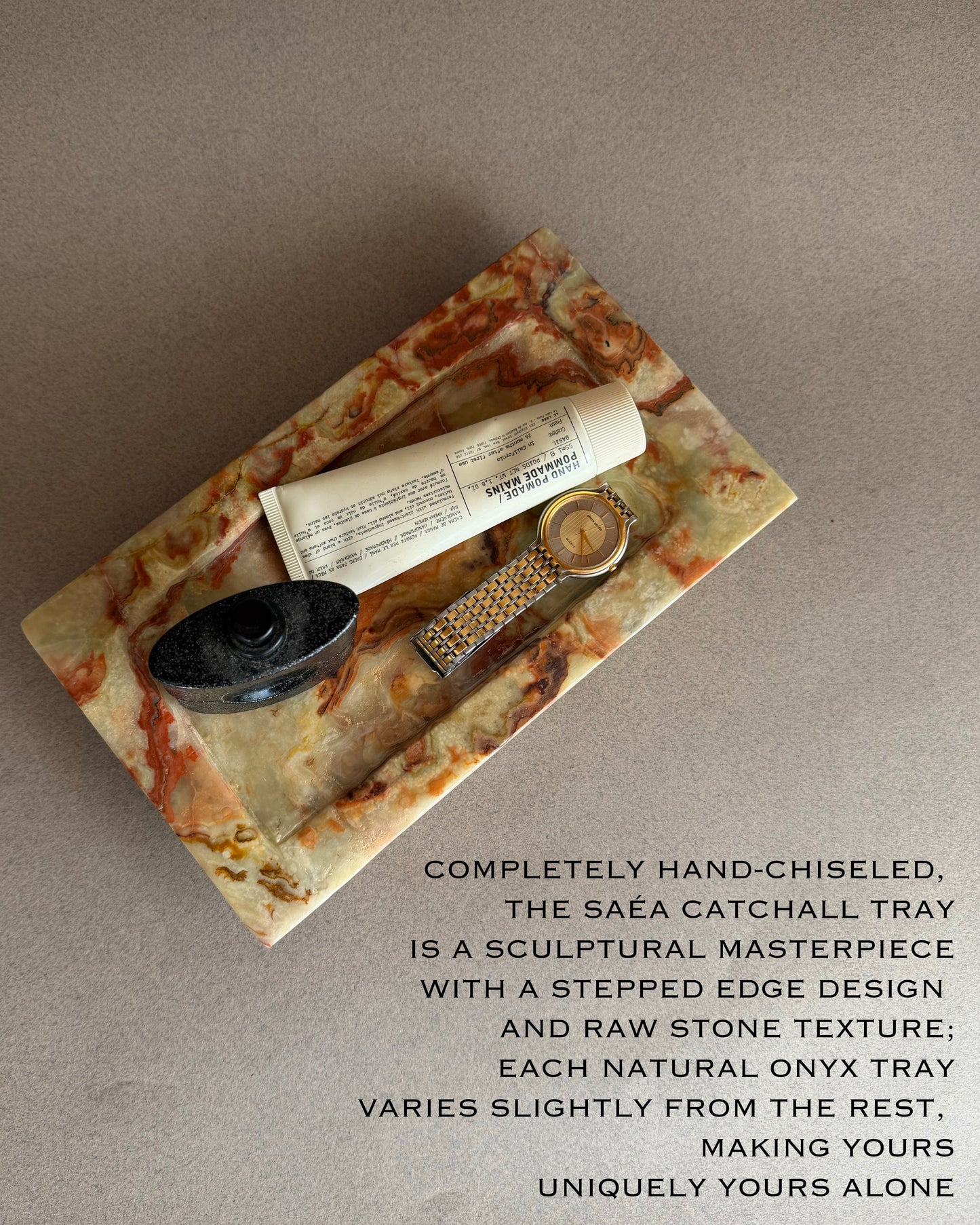 Hand-chiseled Saéa catchall tray with raw stone texture on a neutral background