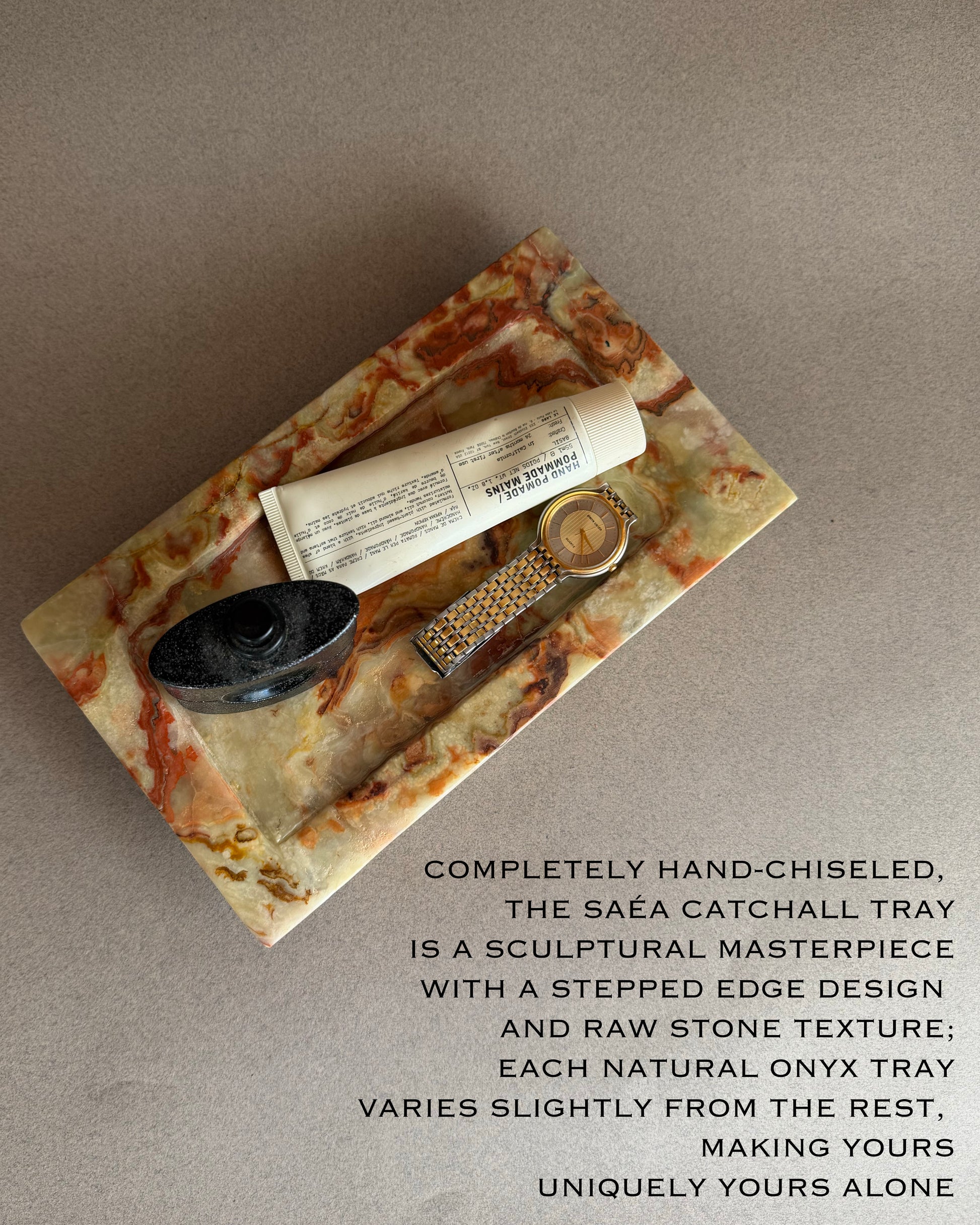 Hand-chiseled Saéa catchall tray with raw stone texture on a neutral background