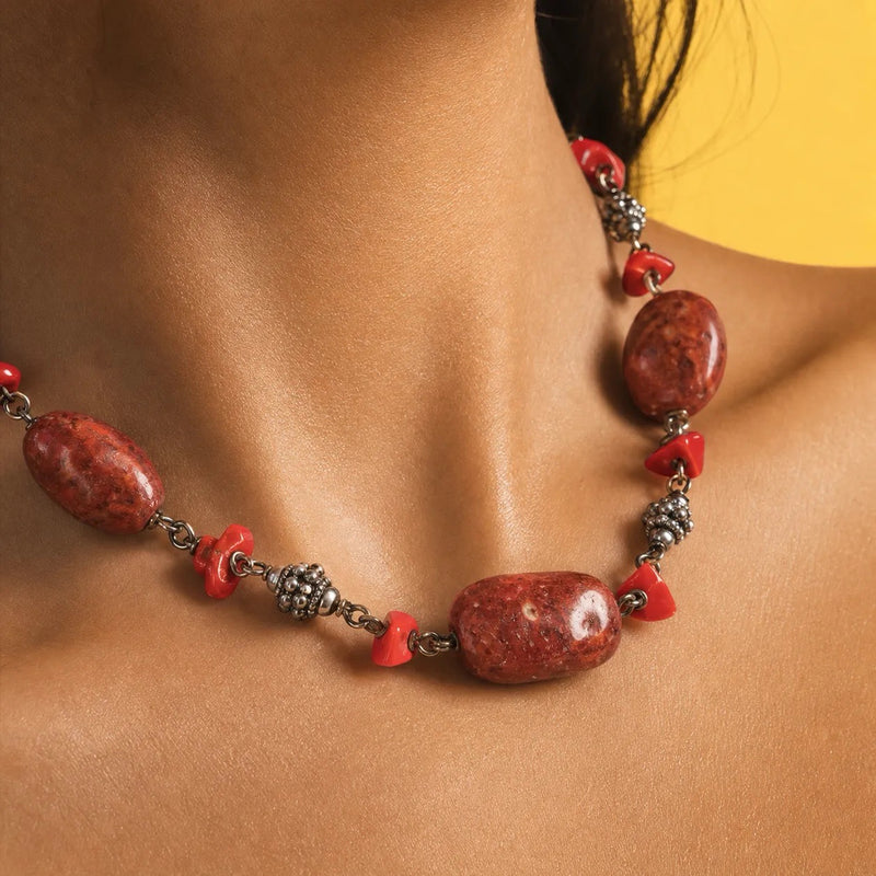 Woman wearing a vintage red jasper and sterling silver choker at the base of the throat, deep red jasper nuggets with jasper chips and silver links