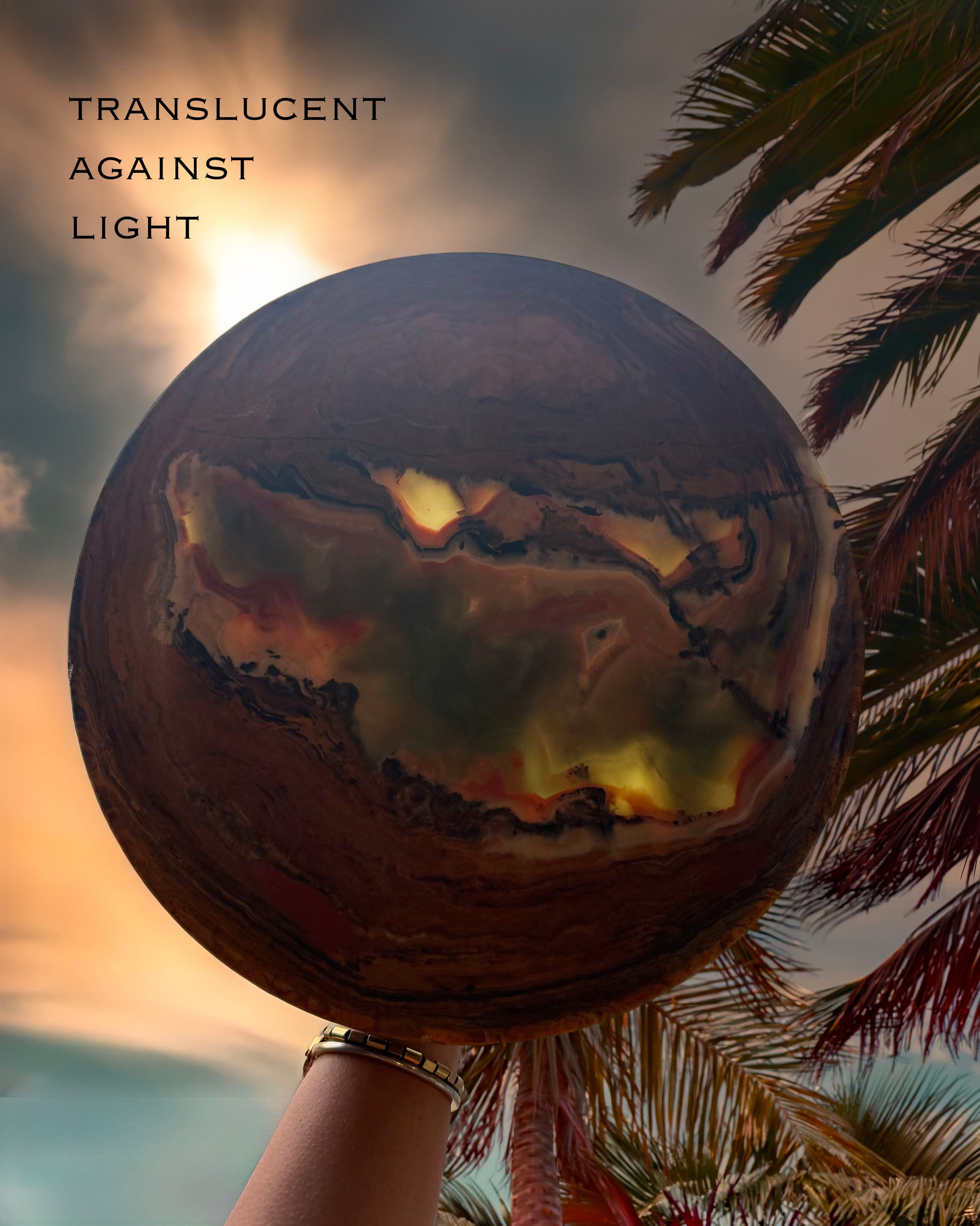 Side profile of raw onyx pedestal bowl with layered brown banding and green stone veining, minimalist studio background
