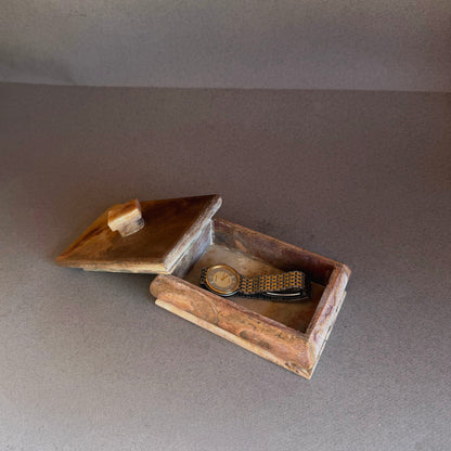 Open onyx trinket box showing natural stone interior and removable lid
