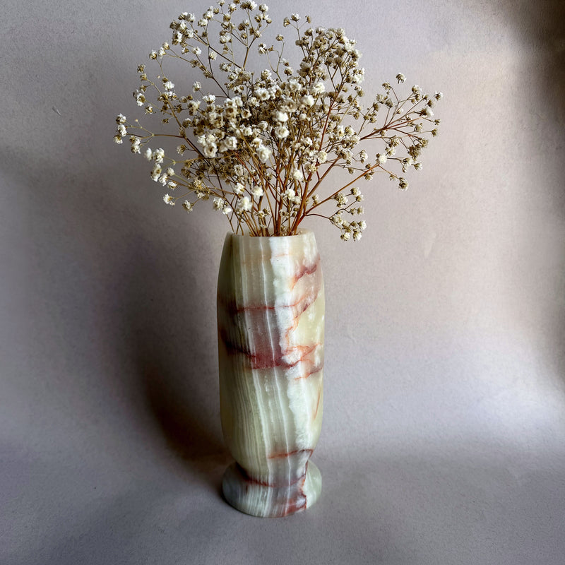 green red onyx vase with dried baby's breath
