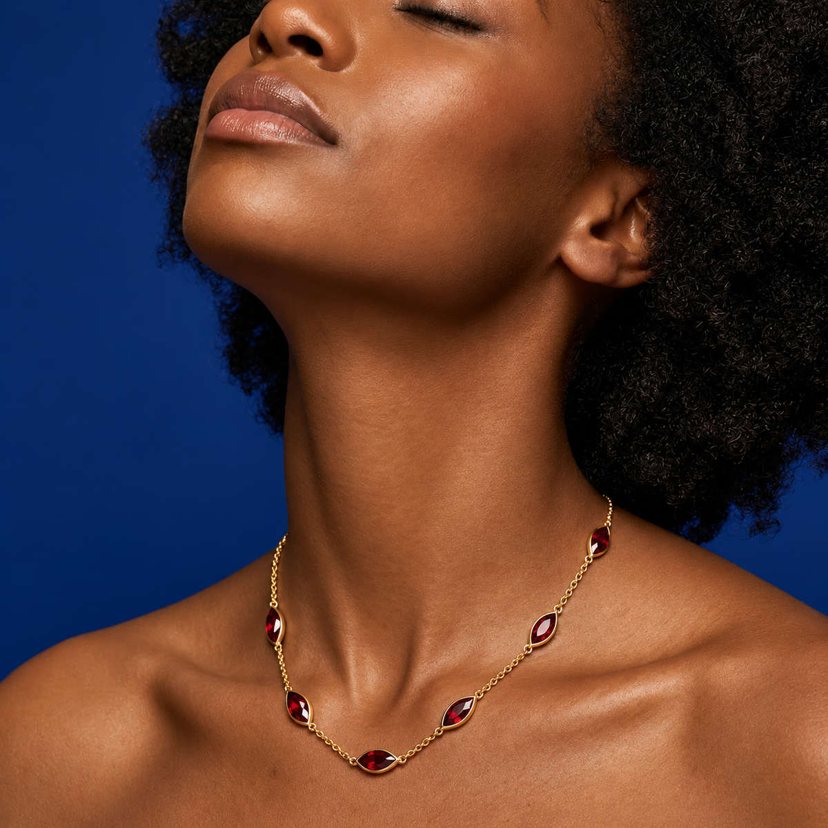Red garnet 18 inch station necklace in gold vermeil, handmade in India, editorial image