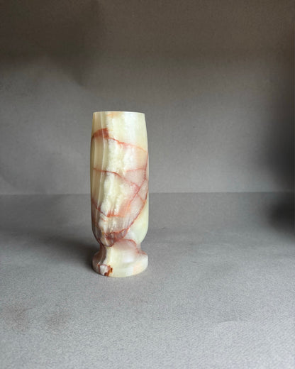 Marble-textured vase on a gray background