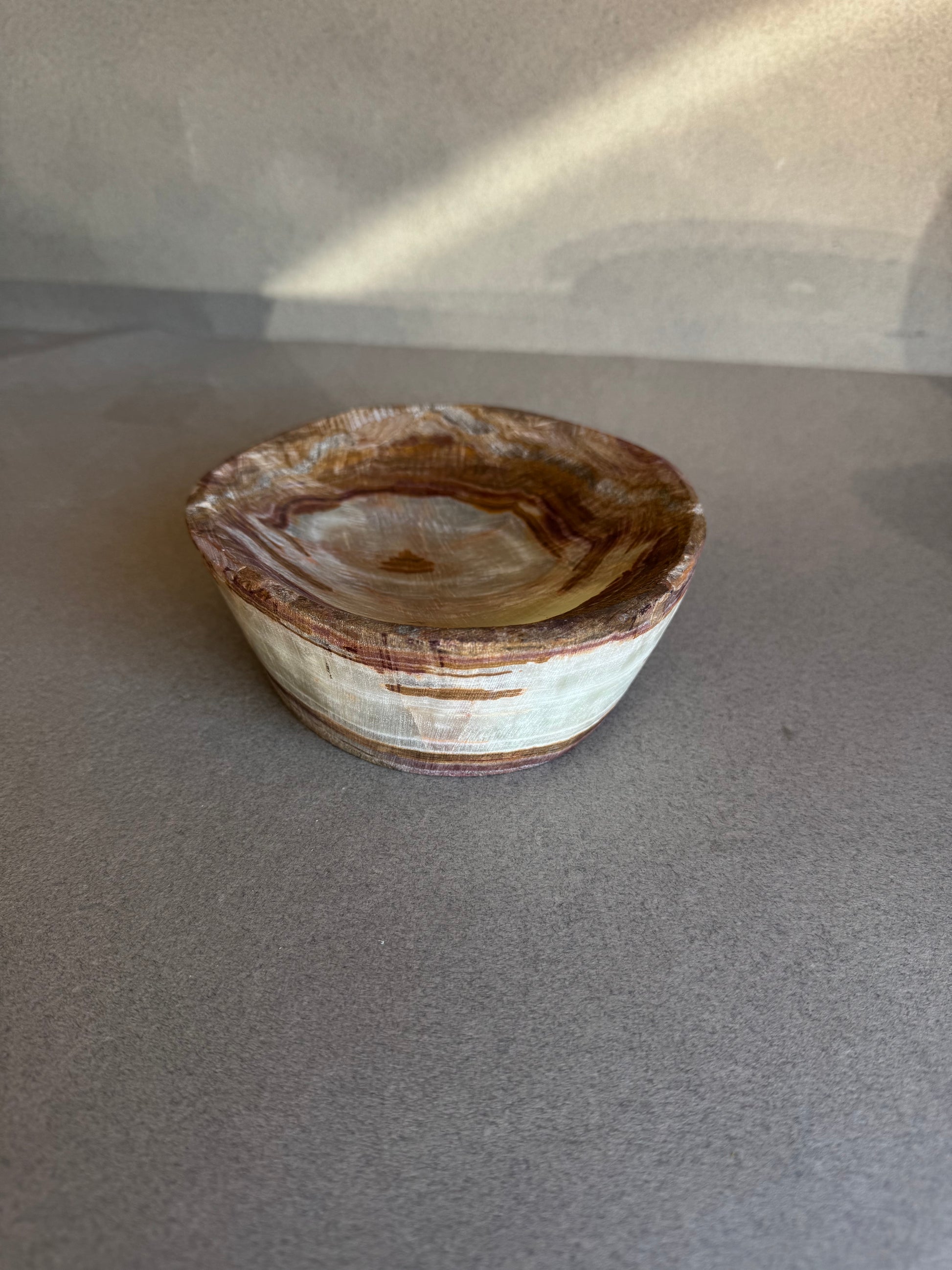 Organic stone jewelry dish in earthy tones, finished in San Diego by SAÉA