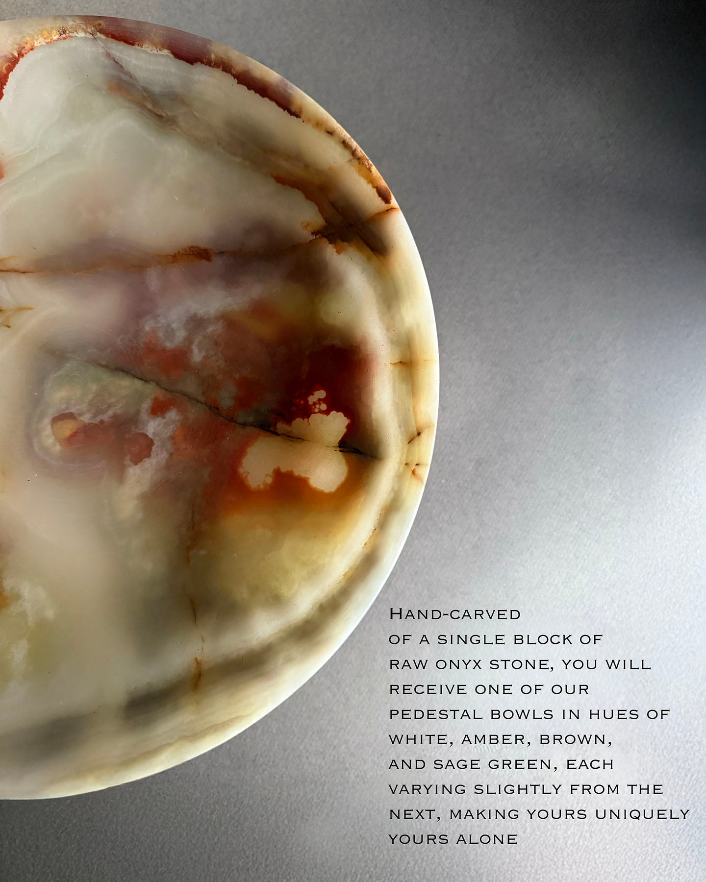 Hand-carved onyx stone pedestal bowl with text description on a gray background