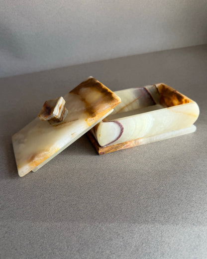 Hand carved natural onyx keepsake box with lid in ivory, honey, and amber stone tones
