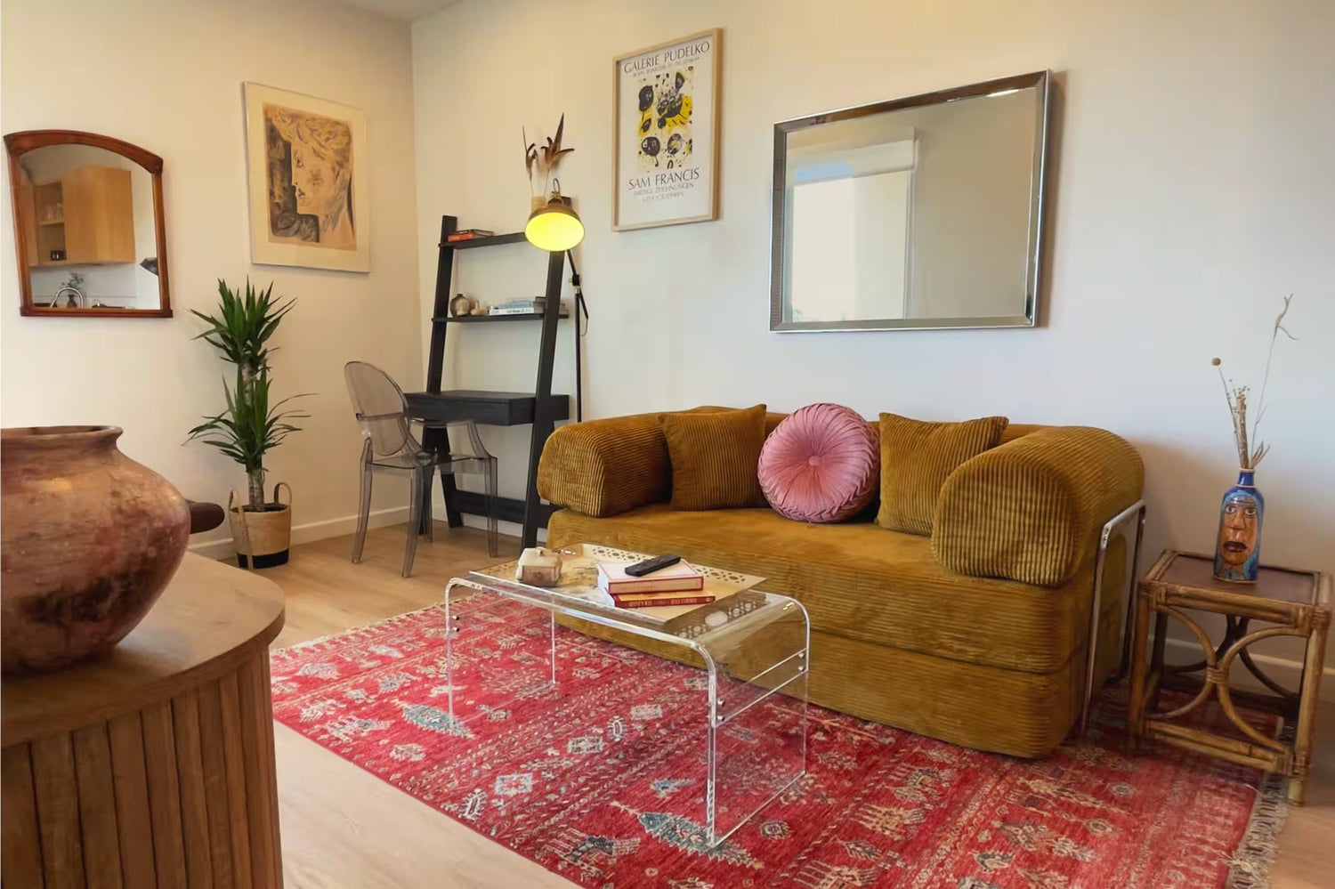 Lounge with mustard sofa and layered rug